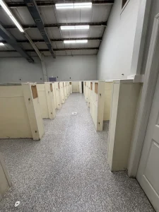 Dog kennel floor protected with epoxy flake coating